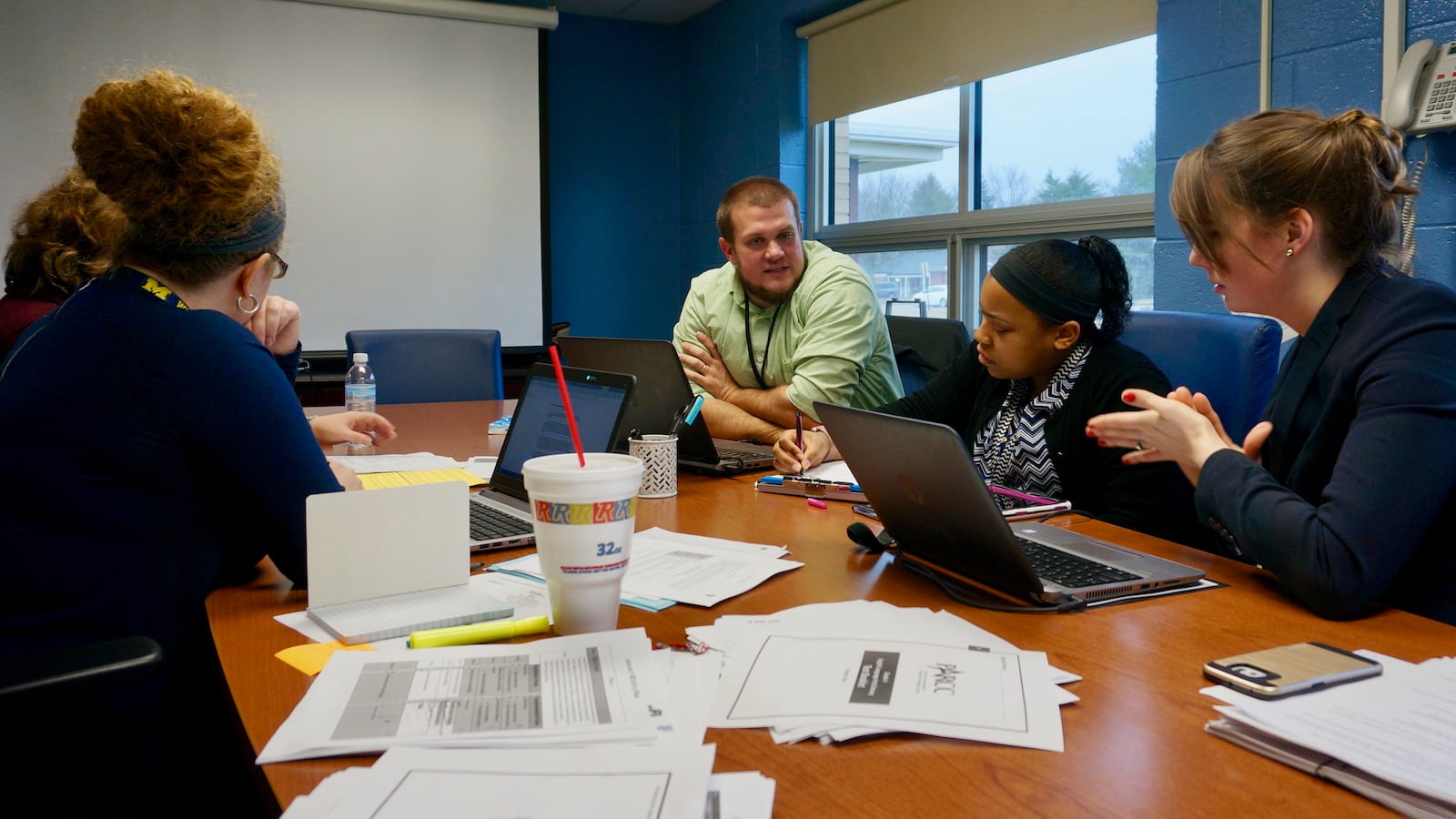 The multi-classroom leaders meet regularly with teachers and district coaches to review data and plan lessons.