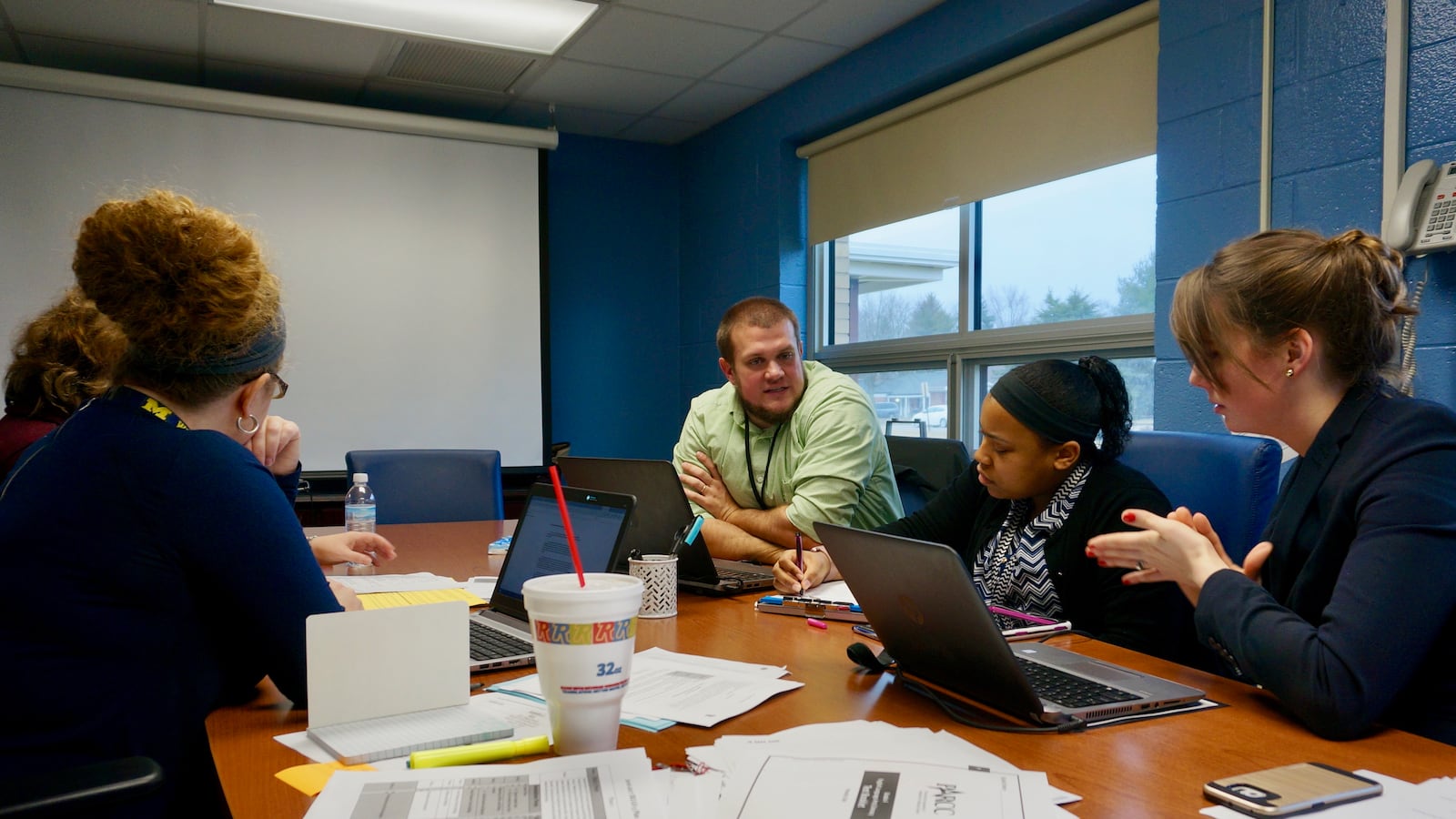 The multi-classroom leaders meet regularly with teachers and district coaches to review data and plan lessons.