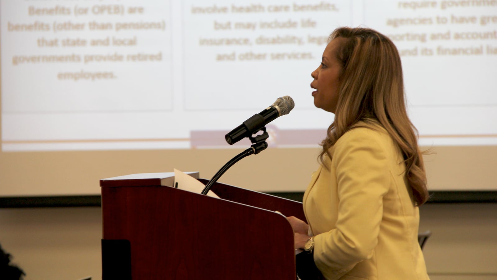Shelby County Schools Human Resources Director Trinette C. Small presents options Monday evening to the district's Board of Education in Memphis.