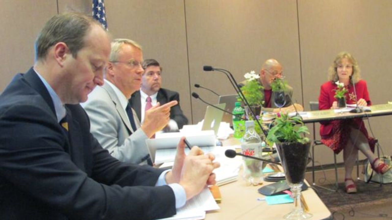 Gordon Henry (left) listens while Dan Elsener (second from the left) speaks at a state board meeting earlier this year. Brad Oliver, Troy Albert and Glenda Ritz look on.