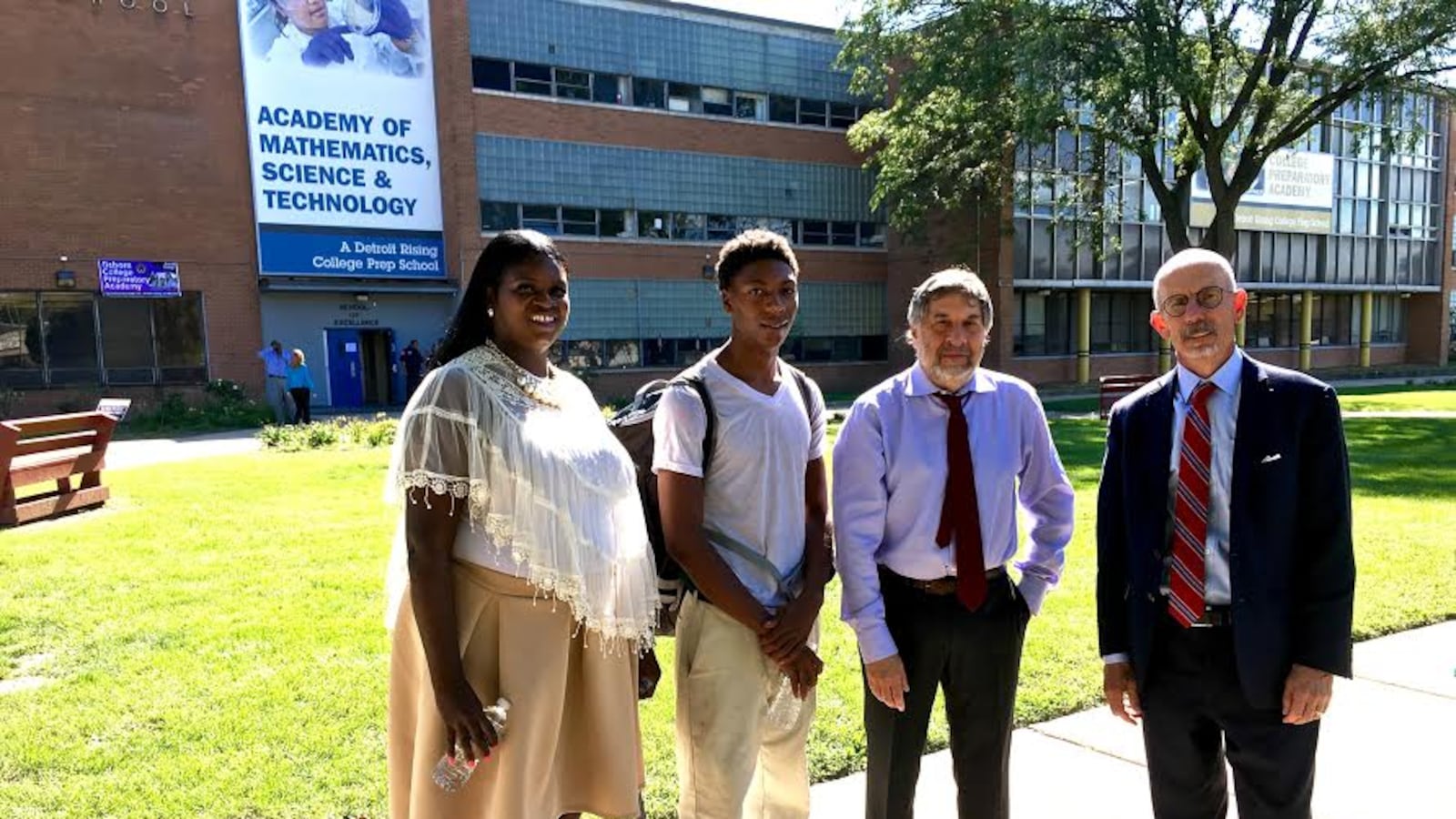 Attorneys behind a new federal civil rights lawsuit meet with Osborn High School college advisor Andrea Jackson and student Jamarria Hall.
