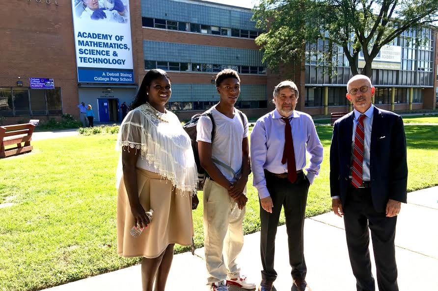 Attorneys behind a new federal civil rights lawsuit meet with Osborn High School college advisor Andrea Jackson and student Jamarria Hall.