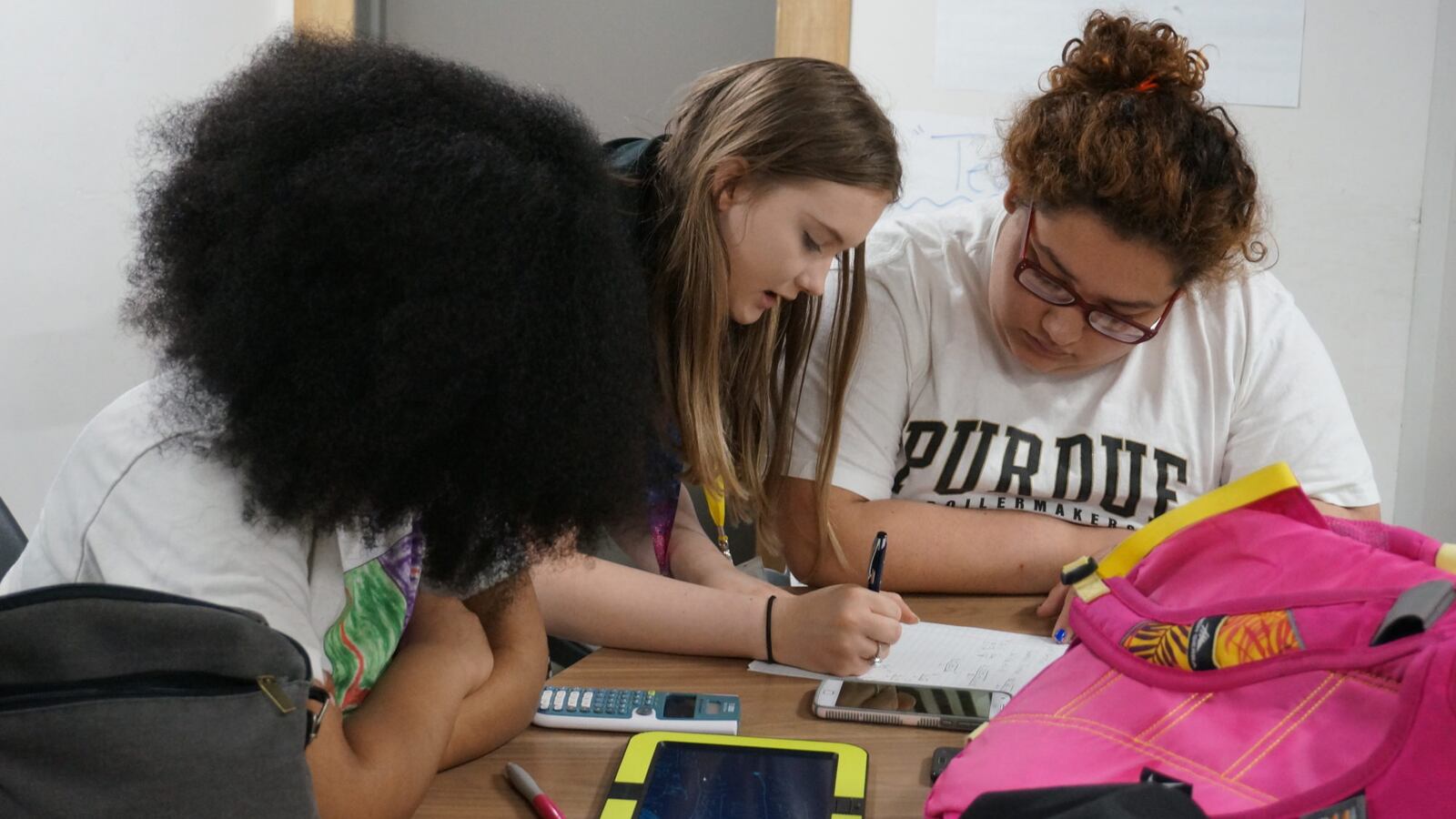 Students at Purdue Polytechnic High School work on quadratic equations.