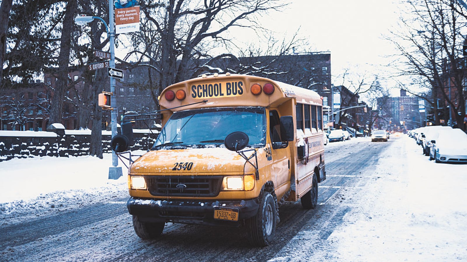 A school bus on Dekalb avenue in Fort Greene Brooklyn during a snow storm.