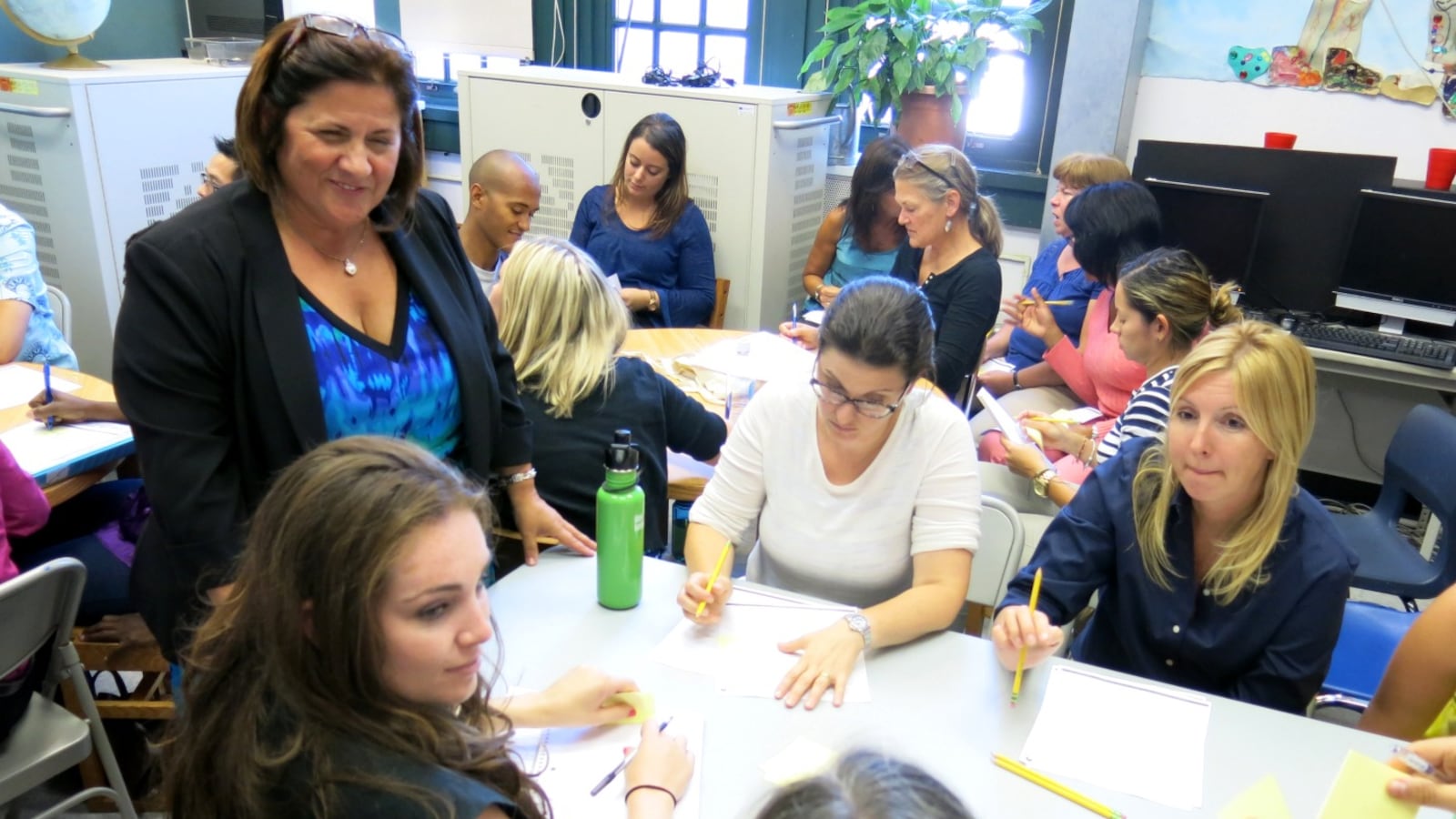 Principal Linda Mazza (left) discussed ways to spend the new 80-minute sessions with teachers at P.S. 295 in Park Slope on Monday.