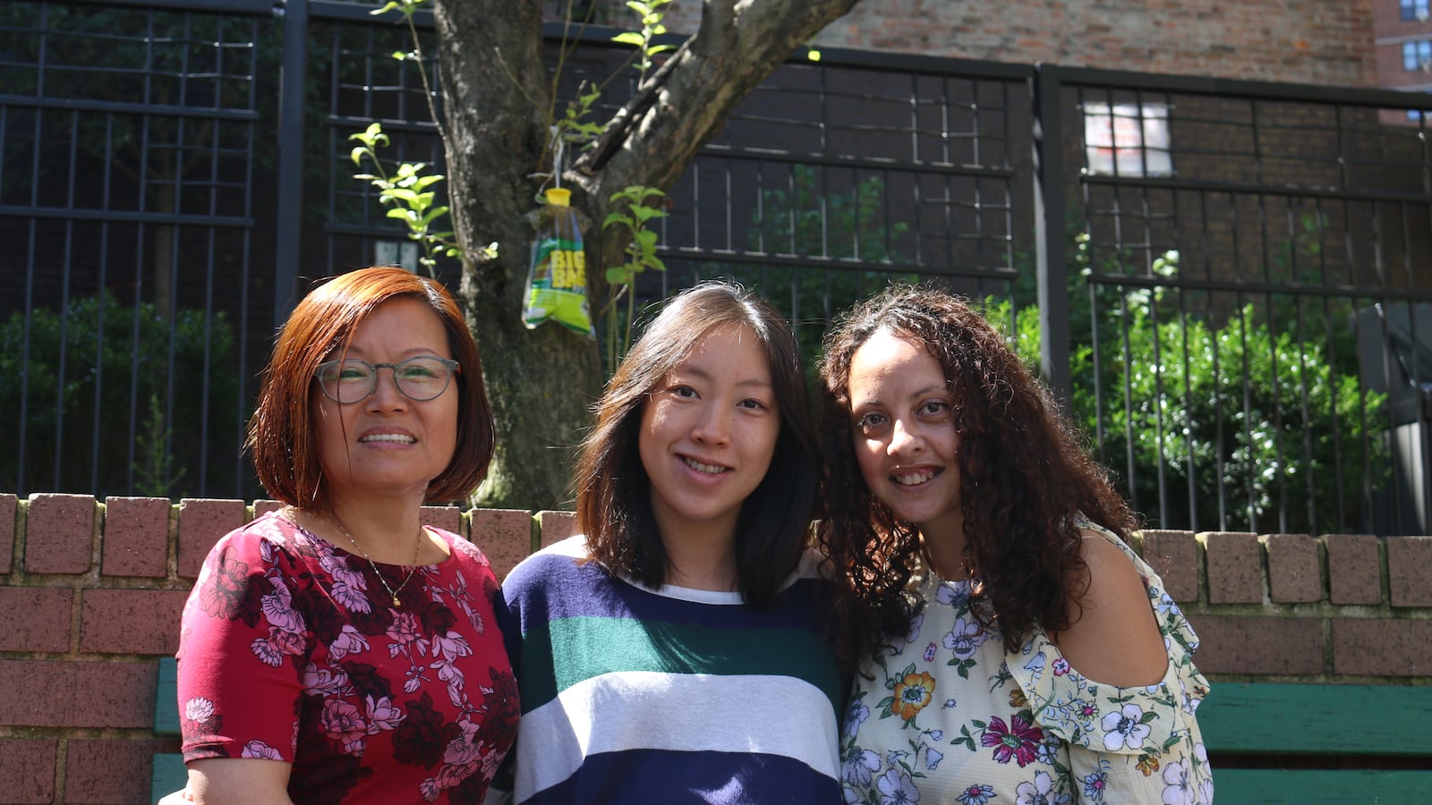 Preschools like Little Star of Broome Street can be a vital link for immigrant families. Teachers Marnie Montalvo, right, and Jenny Wang, left, along with center director Annie Lei, center, work to build trust with their immigrant families.