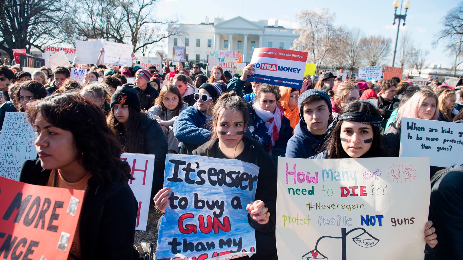 Thousands of local students sit for 17 minutes during a nationwide student walkout for gun control in front the White House on March 14, 2018. (SAUL LOEB/AFP/Getty Images)