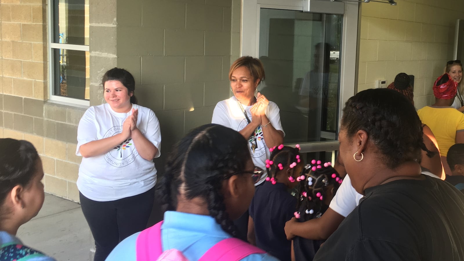 Principal Kim Pritchett, left, welcomes students to the first day of school at the Southwest Detroit Community School. She is the latest principal who hopes to turn the school around.