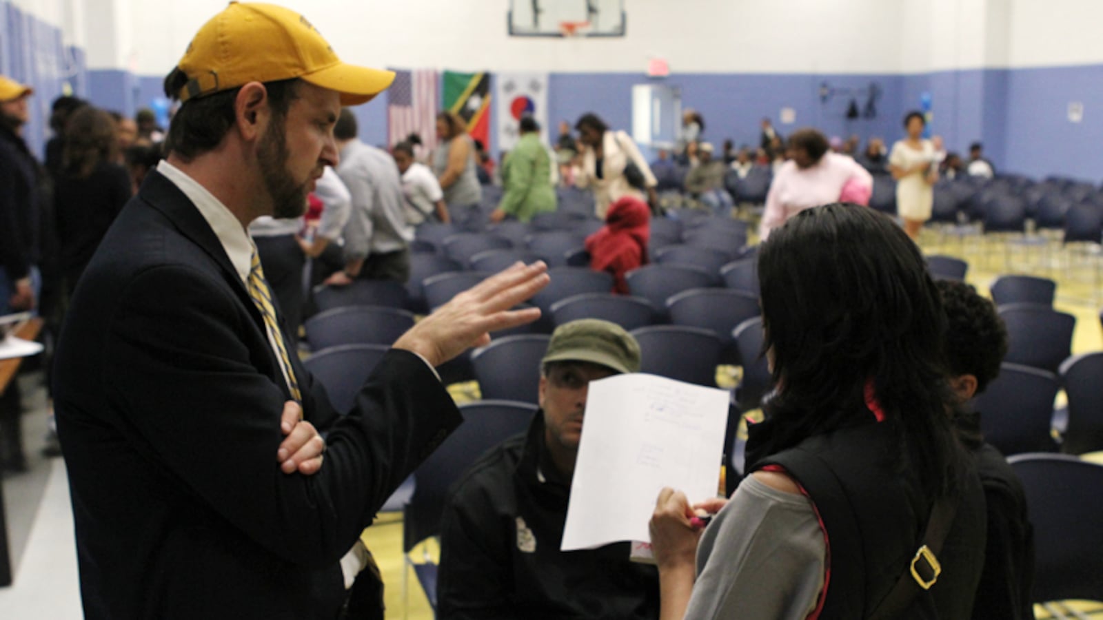 Superintendent Seth Andrew answers questions after the lottery event at Democracy Prep