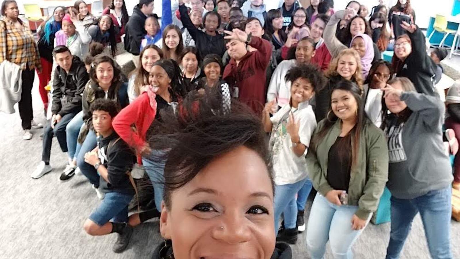 Julia Torres, a school librarian in northeast Denver, with students.