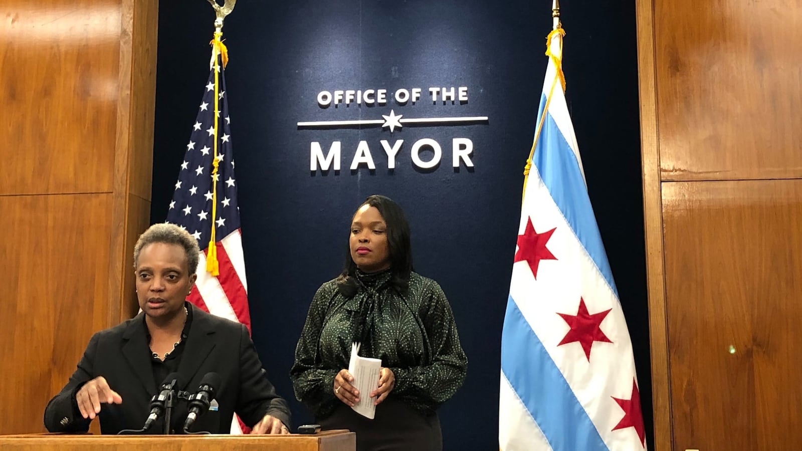 Chicago Mayor Lori Lightfoot speaks at the podium, with schools chief Janice Jackson standing behind, on Oct .15, 2019