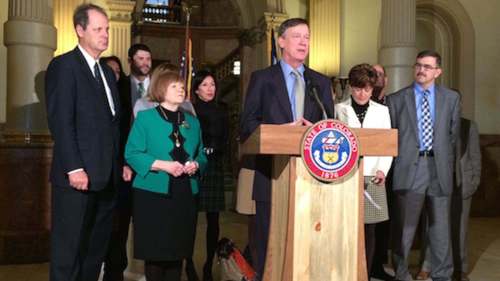 Gov. John Hickenlooper spoke on testing Tuesday, flanked by Senate President Bill Cadman (left) and House Speaker Dickey Lee Hullinghorst.