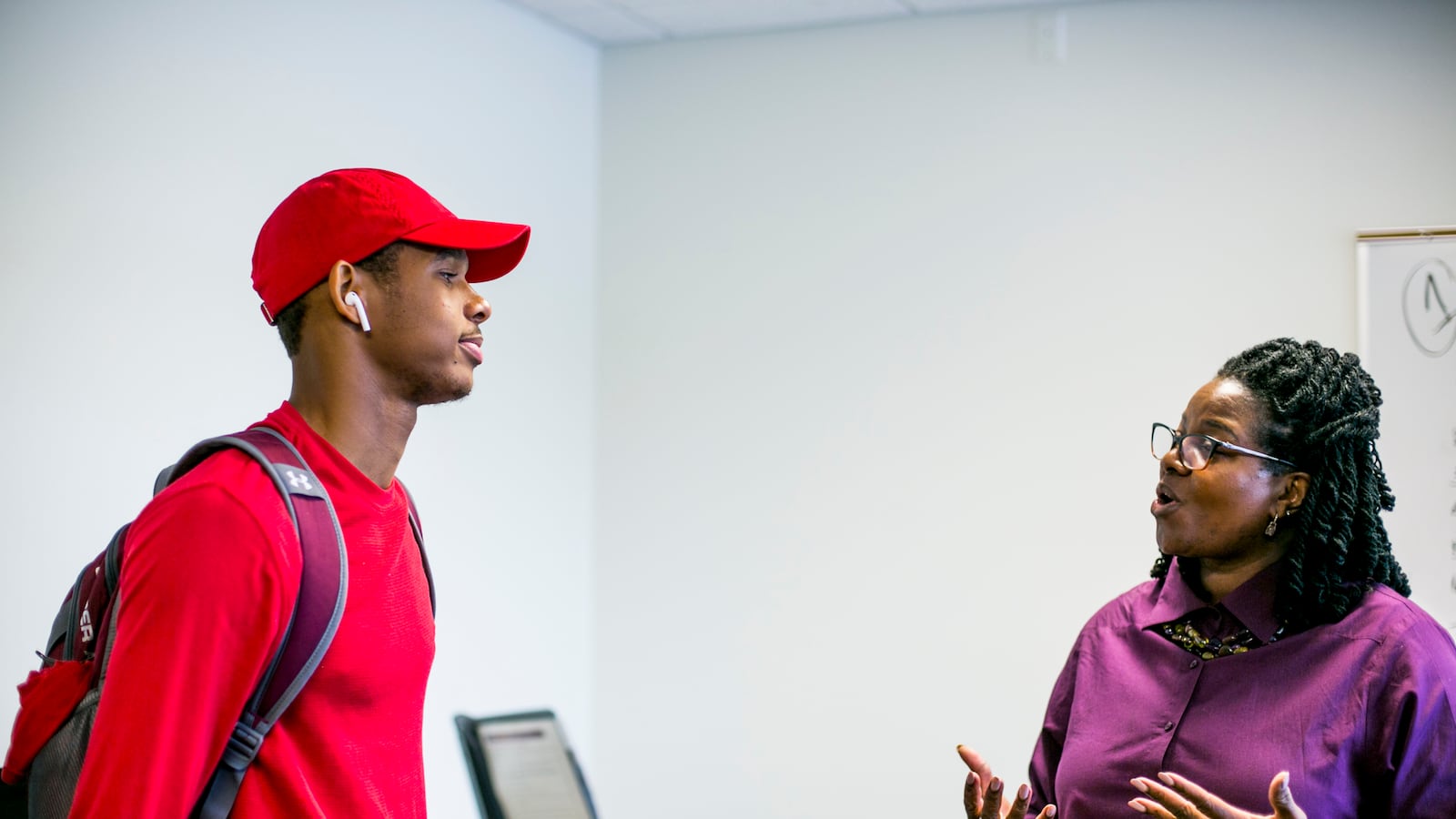 Demetrius Robinson, a freshman at Central Michigan University from Detroit, chats with Mary Henley, who heads a program that helps first generation and low income students succeed on campus.