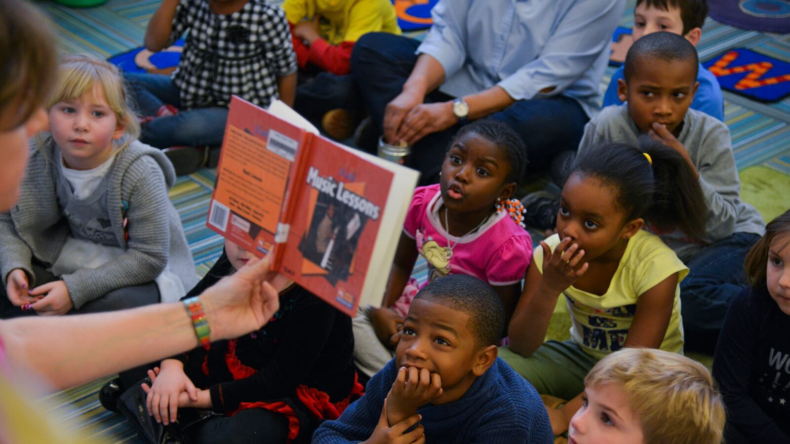 A librarian reads stories to kindergarten students at a public elementary school in Washington, D.C. in February 2015.