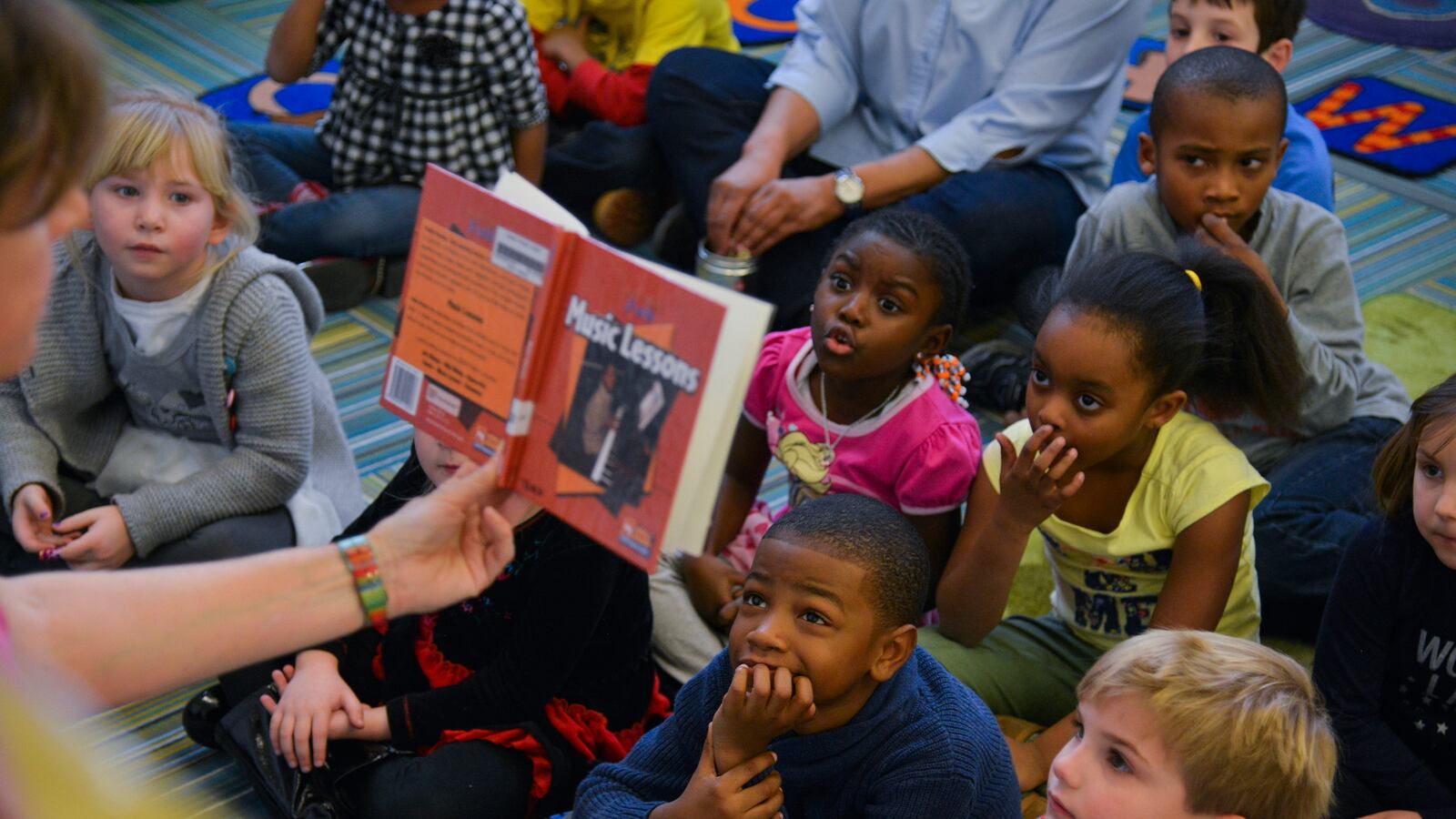 A librarian reads stories to kindergarten students at a public elementary school in Washington, D.C. in February 2015.