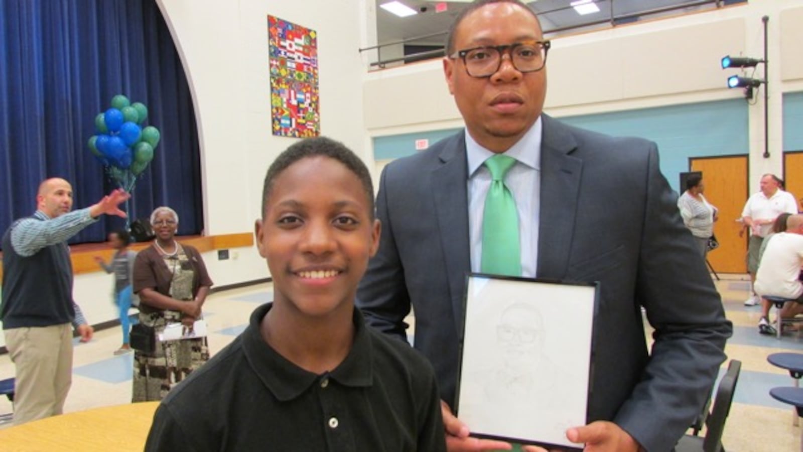 Eric Best drew a portrait of of IPS Superintendent Lewis Ferebee and presented it to him.