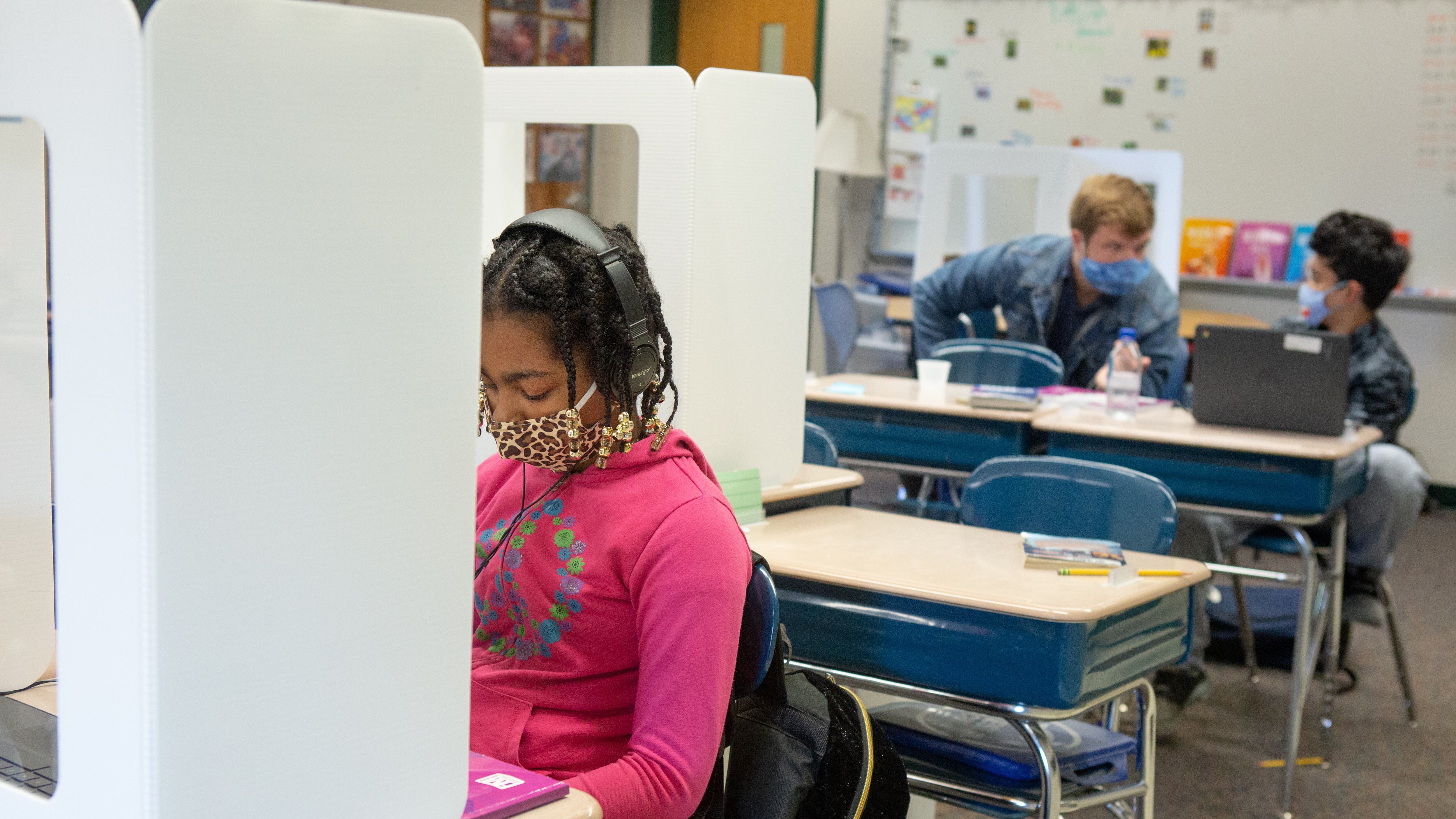 The education department says it has a comprehensive strategy to curb the spread of COVID within schools next year. The strategy includes two air purifiers in each classroom along with mandated masking and social distancing.