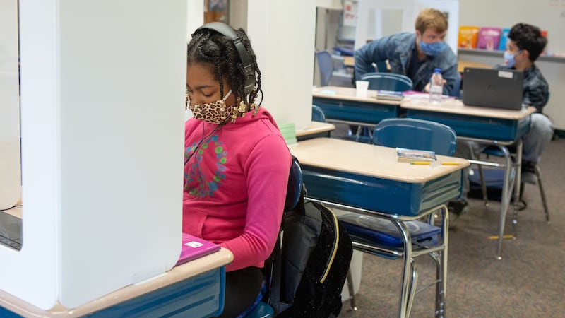 The education department says it has a comprehensive strategy to curb the spread of COVID within schools next year. The strategy includes two air purifiers in each classroom along with mandated masking and social distancing.
