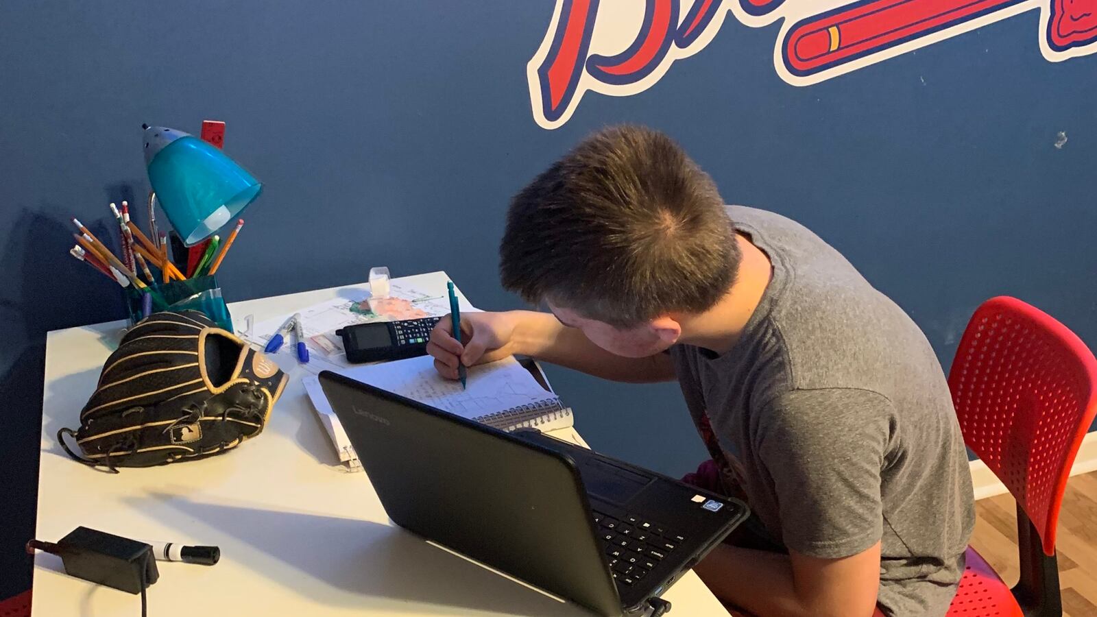 Brody McMurray, a ninth-grader at Maryville Junior High School, works Wednesday on a geometry lesson at home using a laptop provided by Maryville City Schools. The Knoxville-area district provides devices to all 5,400 of its students and was positioned well to respond to school shutdowns due to the spread of the new coronavirus.