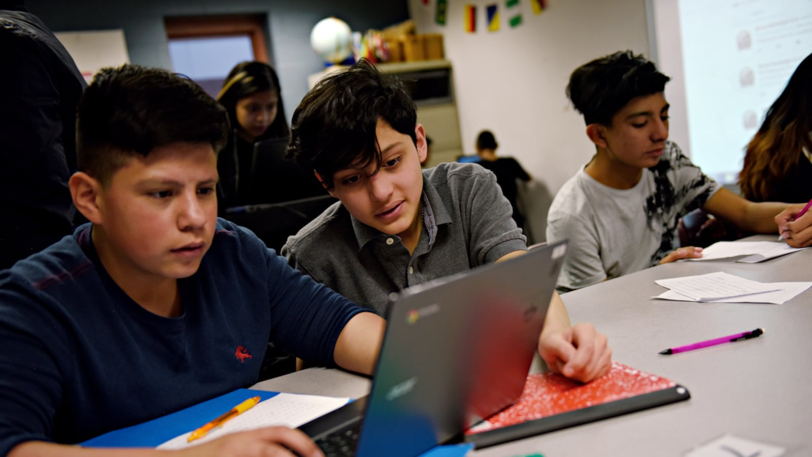 Alejandro Moya, left, and Salvador Garcia look at tweets together that students were adding to a Google Doc as drafts before tweeting them out. Students from Bruce Randolph School tweeted messages to President Donald Trump on Wednesday.