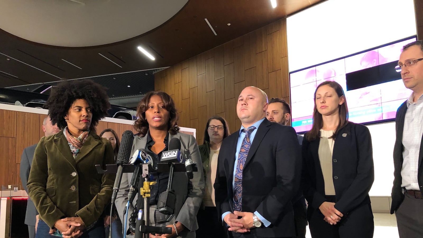 Chicago's Deputy Mayor Sybil Madison, left, Chicago Public Schools Chief Education Officer LaTanya McDade, and the school district's Chief Operating Officer Arnie Rivera, joined by members of the Chicago Public Schools bargaining team, talked with reporters after negotiations at 2:30  a.m. Oct 29, 2019, about progress in contract bargaining.