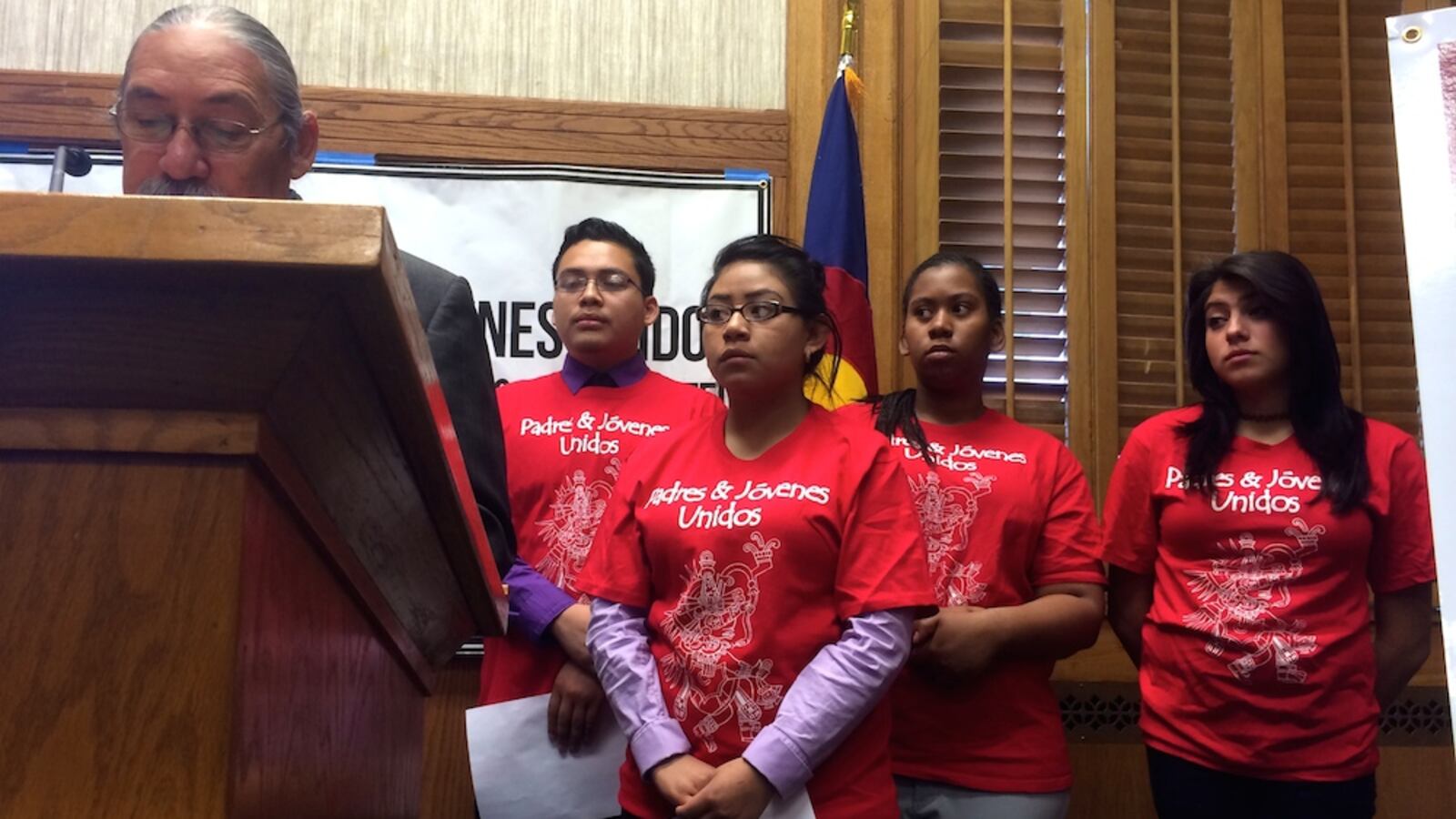 Students from right, Maria Recendes, Alexandra Pough, Diana Marquez and Jhovani Becerra listen to Ricardo Martinez, co-executive director of Padres y Jovenes Unidos at a March 28 press conference. The organization released the first report on student discipline trends after a 2012 law eliminated most of Colorado school's zero-tolerance policies.