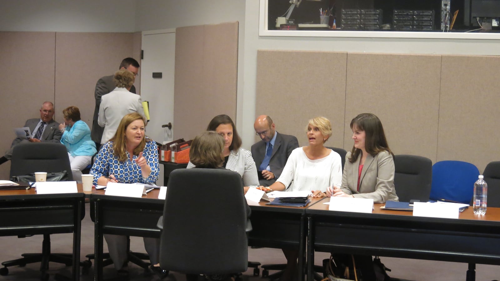 Education Commissioner Candice McQueen (right) discusses assessments during a task force meeting.