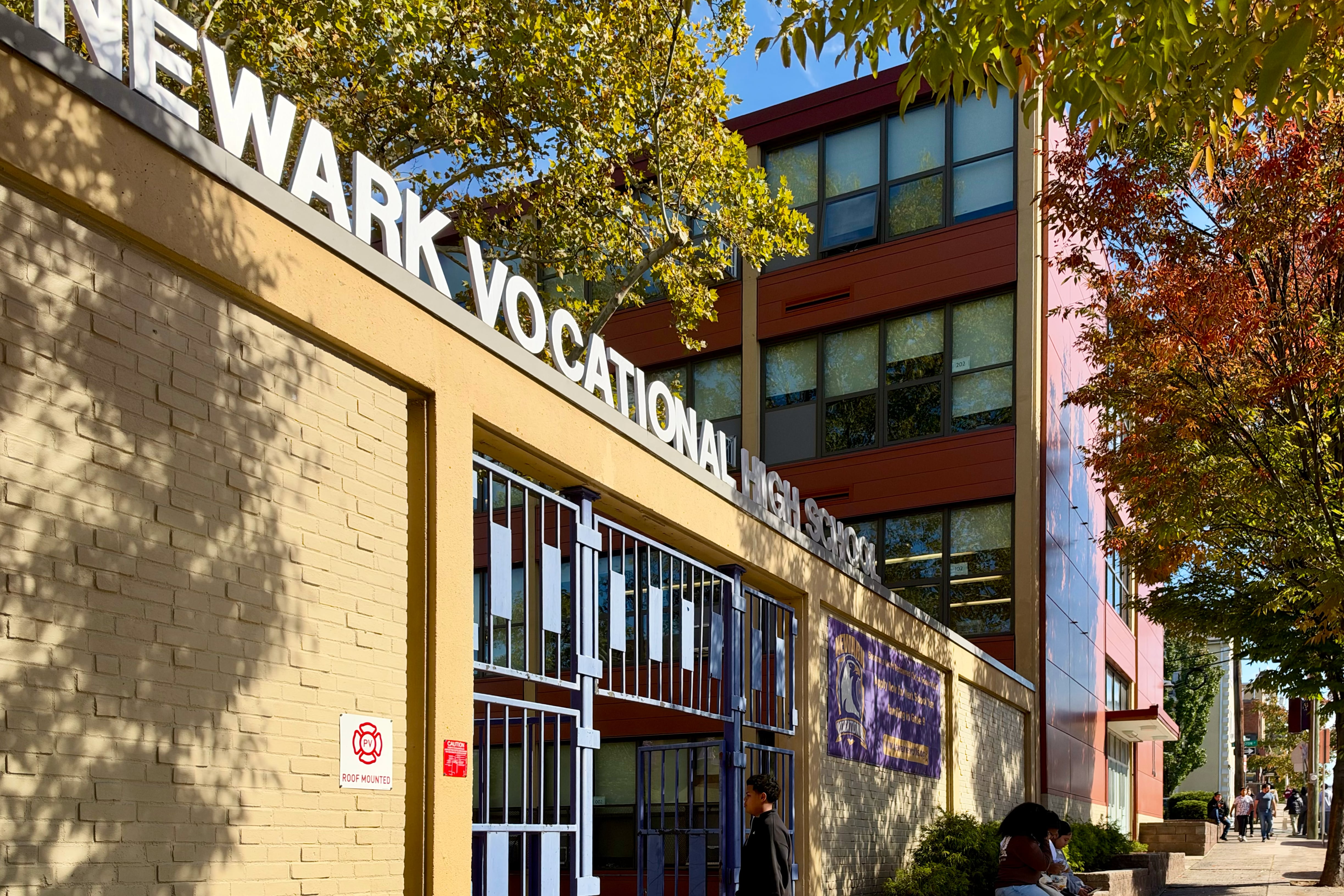 The outside of the Newark Vocational High School on a sunny day.