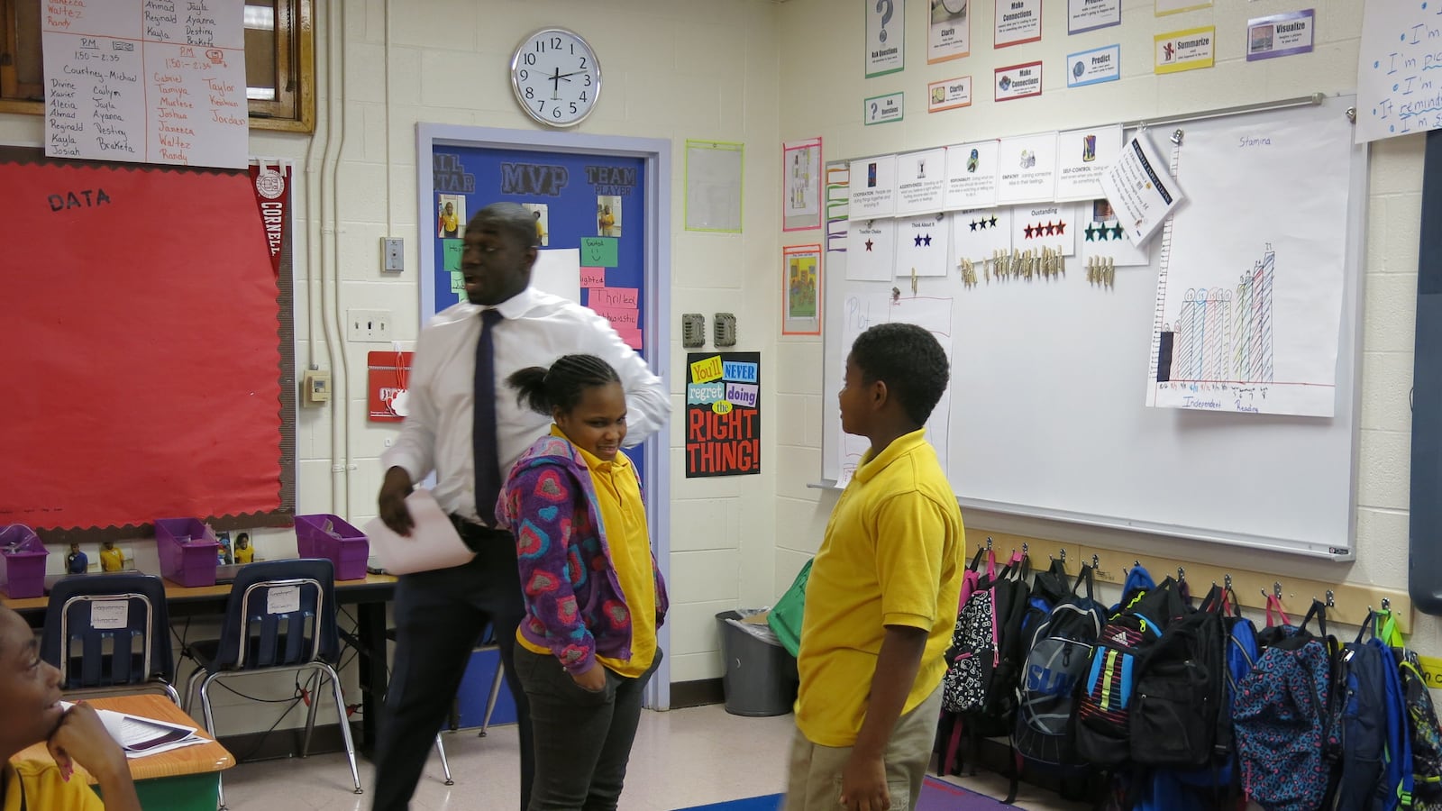 Aspire teacher Ayo Akinmoladun picks two students to act out a scene from "Growing Pains."