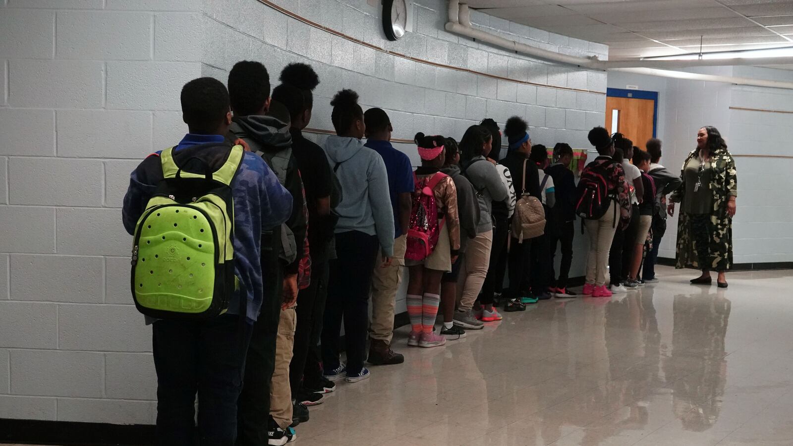 Students stand in line in a hallway outside a classroom door at Gardenview Elementary School in Memphis, Tennessee. —May, 2019—  Photo by Karen Pulfer Focht/Chalkbeat