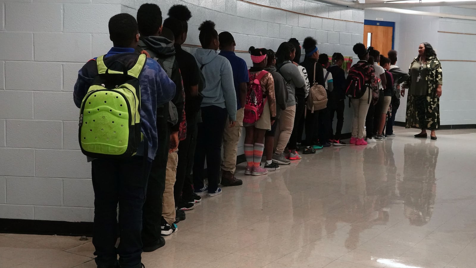 Students stand in line in a hallway outside a classroom door at Gardenview Elementary School in Memphis, Tennessee. —May, 2019—  Photo by Karen Pulfer Focht/Chalkbeat