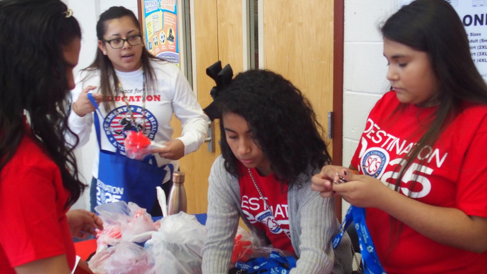 Talia Palacio directs student volunteers at a Hispanic Heritage Month event in October. Palacio is the newly hired specialist handling communication between Shelby County Schools and Memphis' growing Hispanic community.