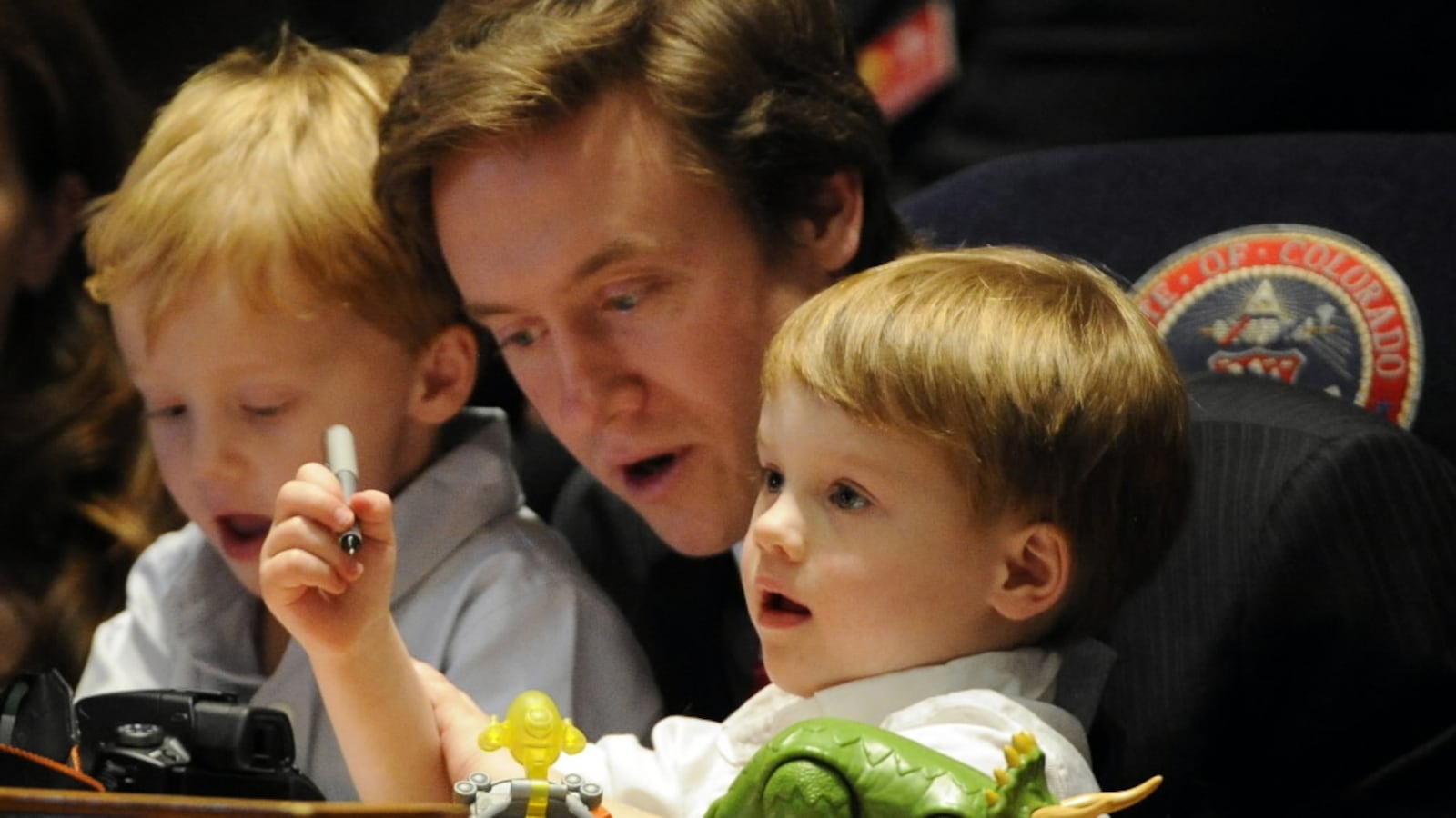 State Sen. Michael Johnston with his children on the Senate floor at the start of the 2012 session.