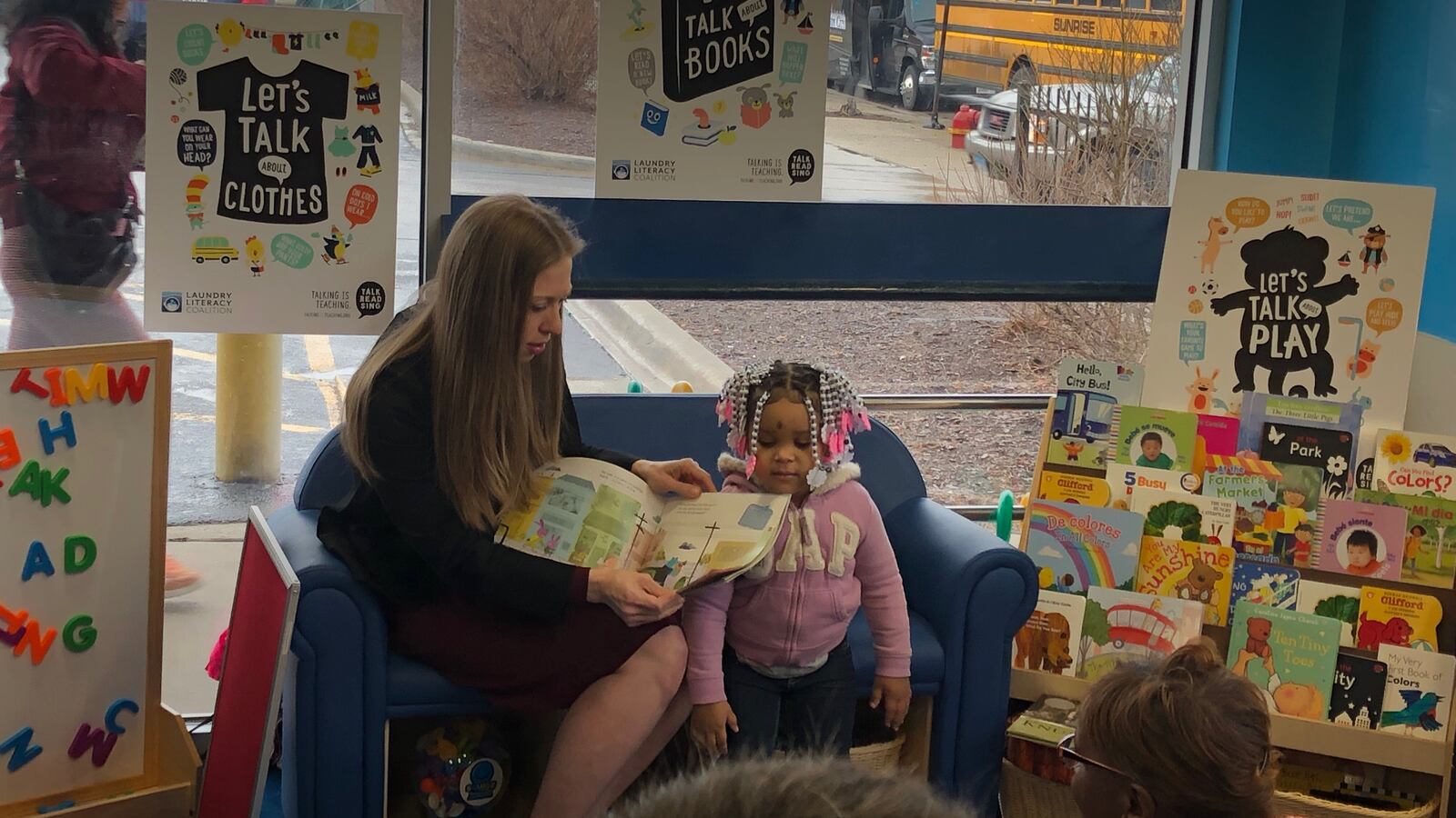 Clinton visited a Hermosa laundromat to help promote an early literacy program championed by her Too Small to Fail organization.
