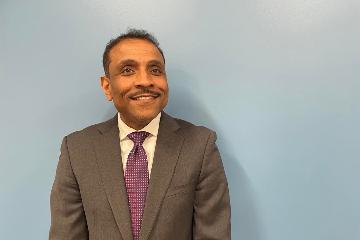 Philadelphia superintendent Tony Watlington stands in a brown suit inside school district headquarters