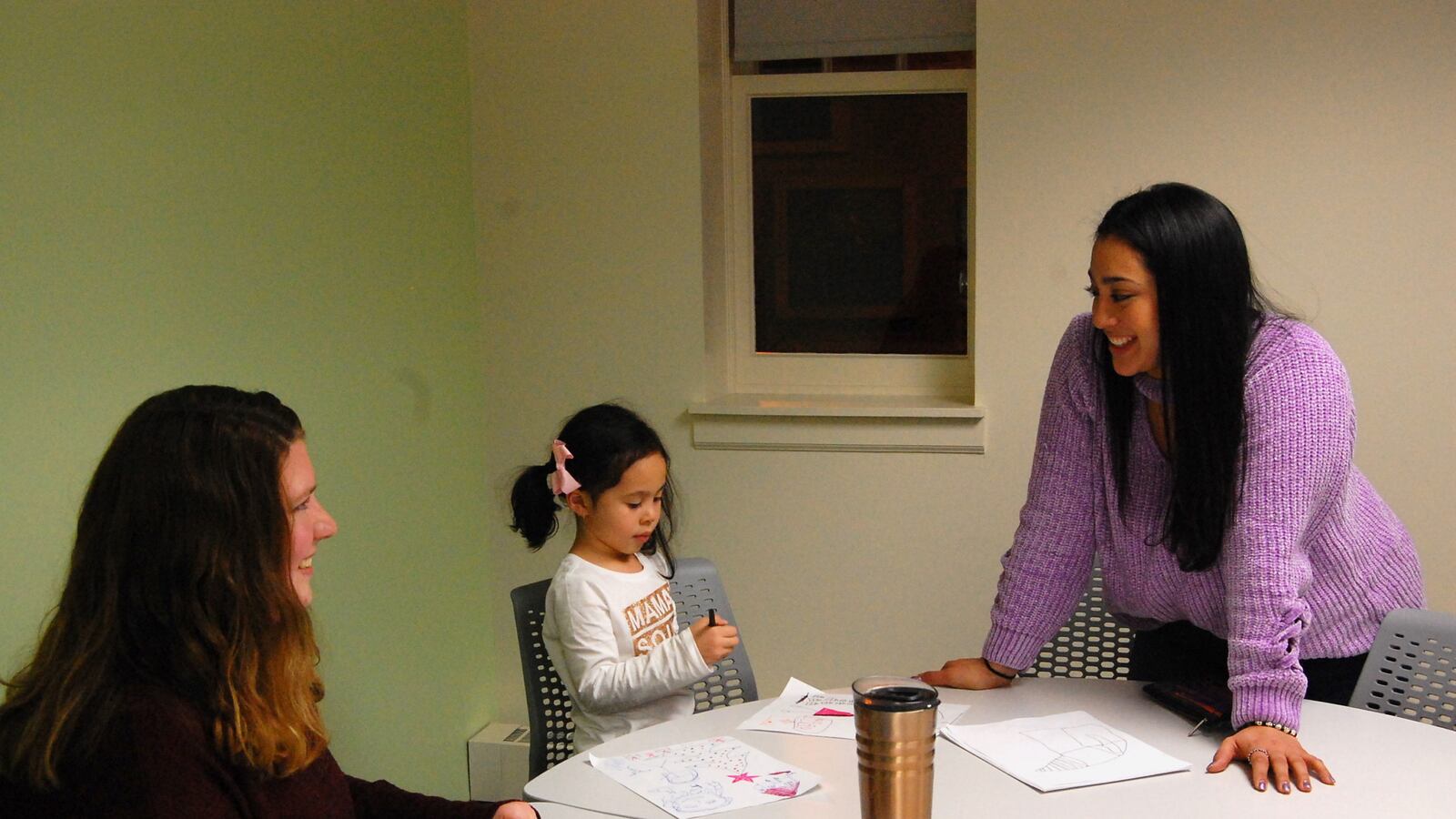 In December, Afrodita Salgado (right) brought her 5-year-old daughter, Amelia, to meet with her coach, Angela Crawford Neven, in a Chicago public library as part of a new online college program.