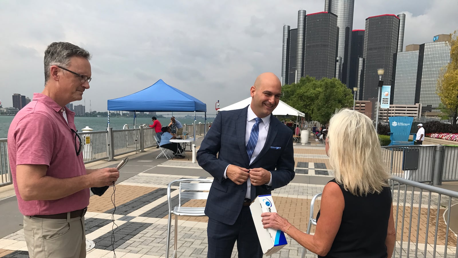 Detroit schools Superintendent Nikolai Vitti prepares for a TV interview on Detroit's RiverWalk in August 2017, before the start of his first school year at the helm of the district.