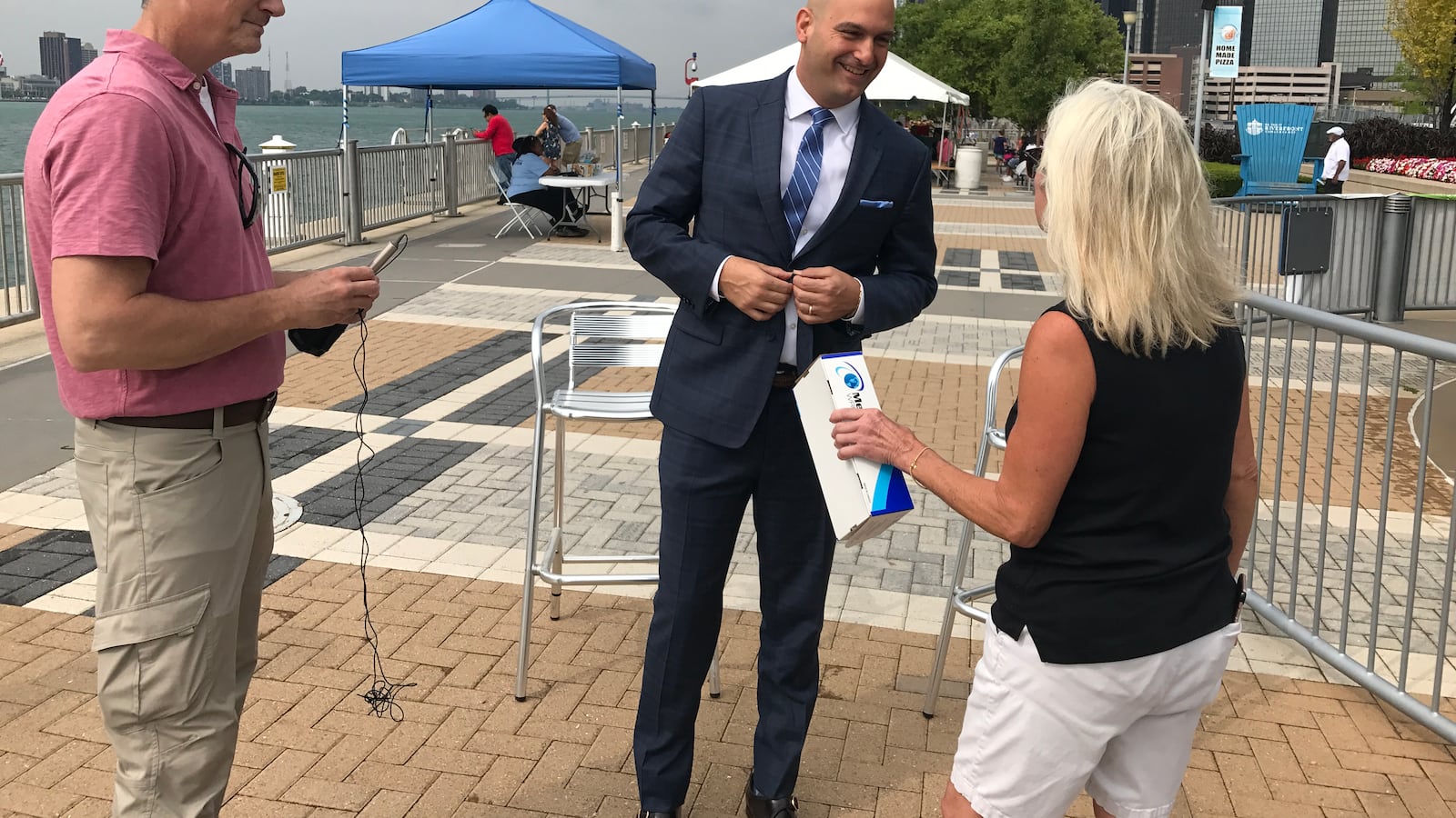 Detroit schools Superintendent Nikolai Vitti prepares for a TV interview on Detroit's RiverWalk in August 2017, before the start of his first school year at the helm of the district.