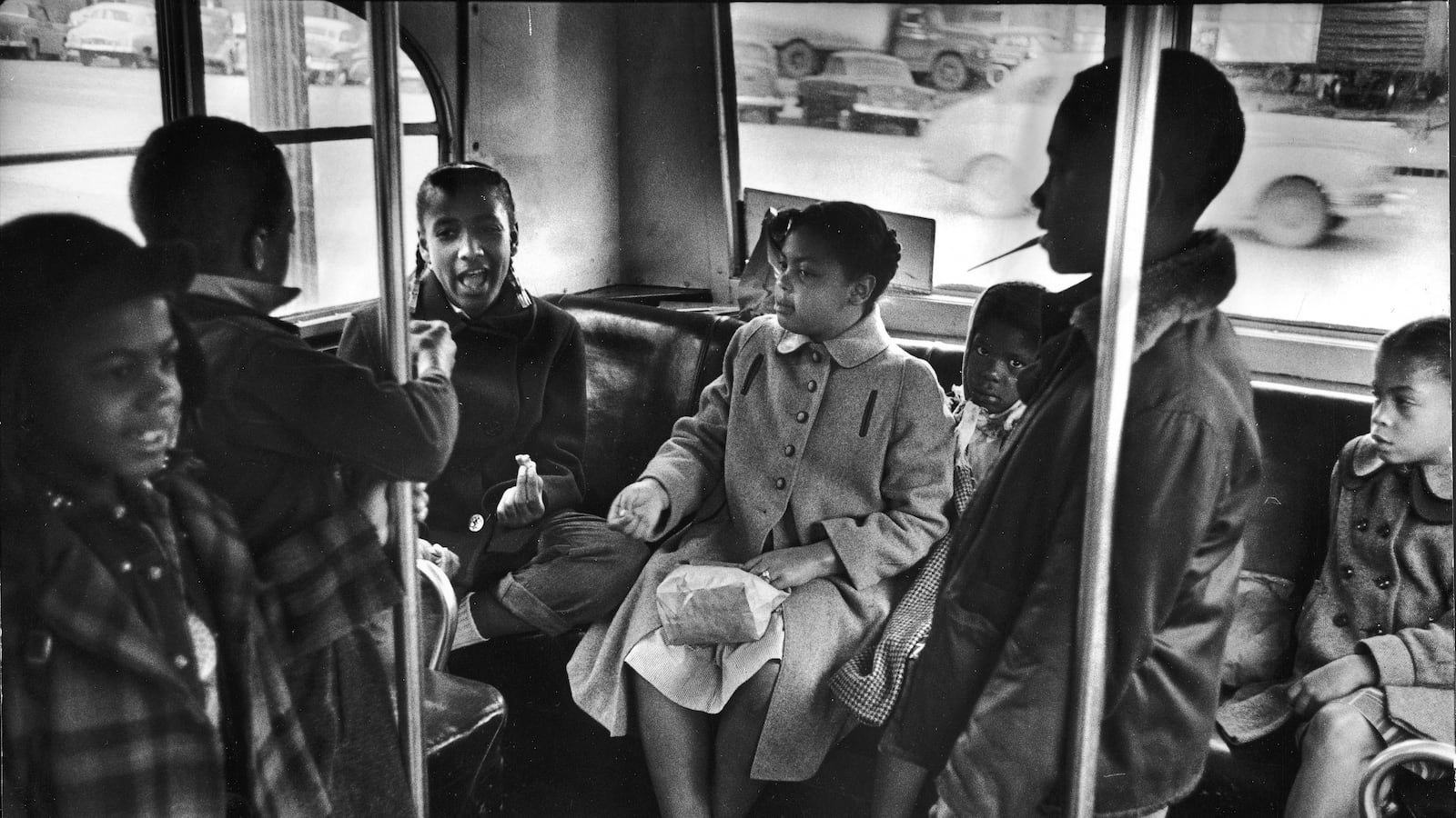 Linda Brown (center) and her sister Terry Lynn (far right) sit on a bus as they ride to the racially segregated Monroe Elementary School, Topeka, Kansas, March 1953. (Photo by Carl Iwasaki/The LIFE Images Collection/Getty Images)