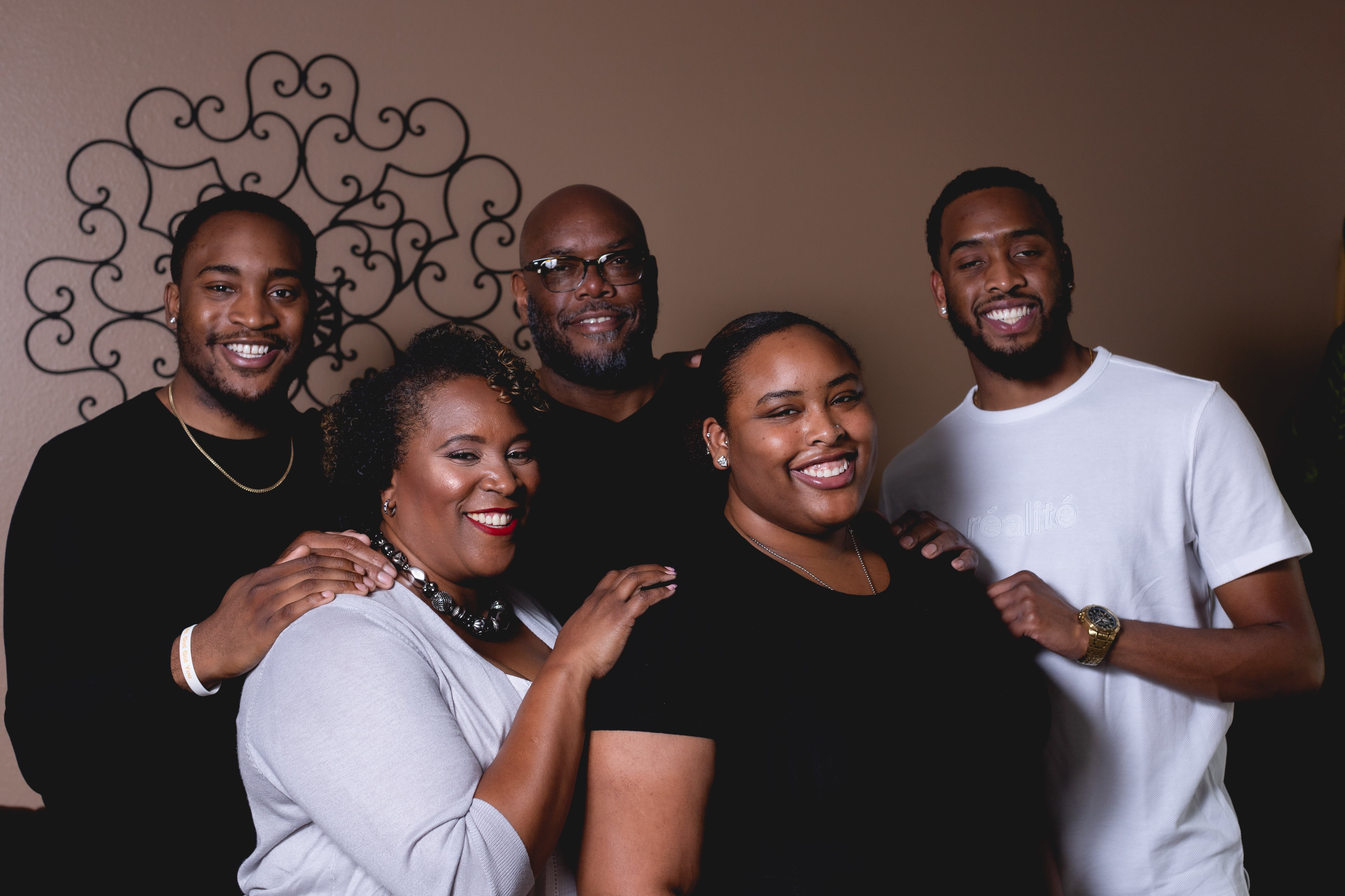 A portrait of Denver School Board candidate Michelle Quattlebaum and four family members.