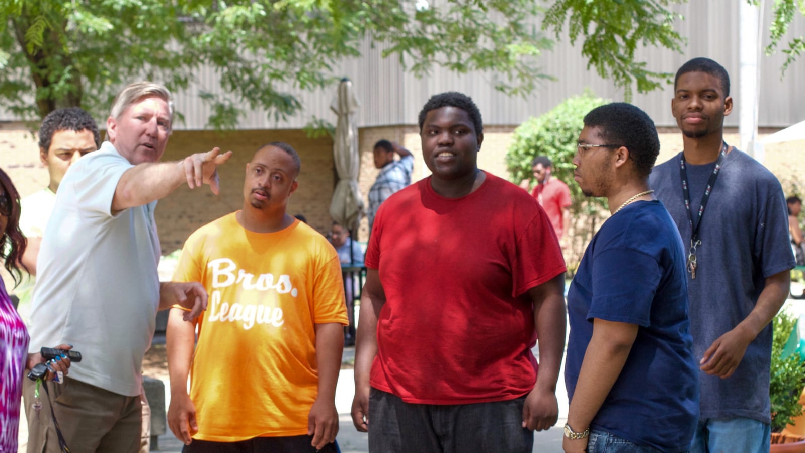 Michael Craig, left, was a 2015 finalist for Michigan Teacher of the Year for his work with students with disabilities at a farm run by the city's main district.