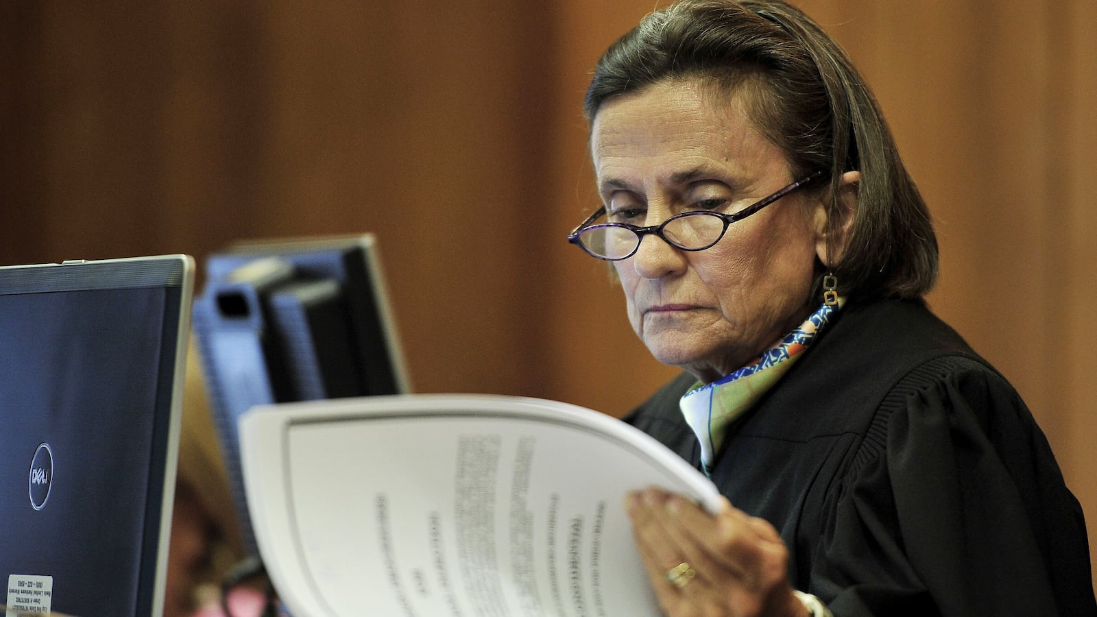 Chancellor Claudia Bonnyman looks over evidence during a 2015 trial. The Nashville judge is presiding over a school funding lawsuit that pits Tennessee's two largest districts against the state.