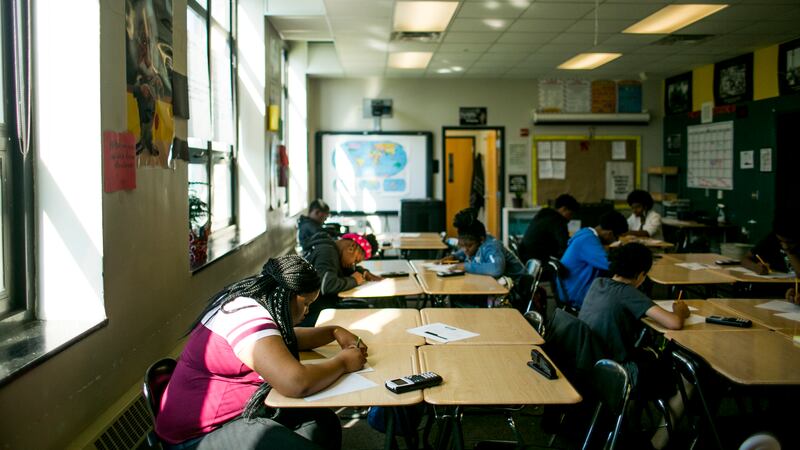Students at work at tables in a math class at Detroit’s Southeastern High School,