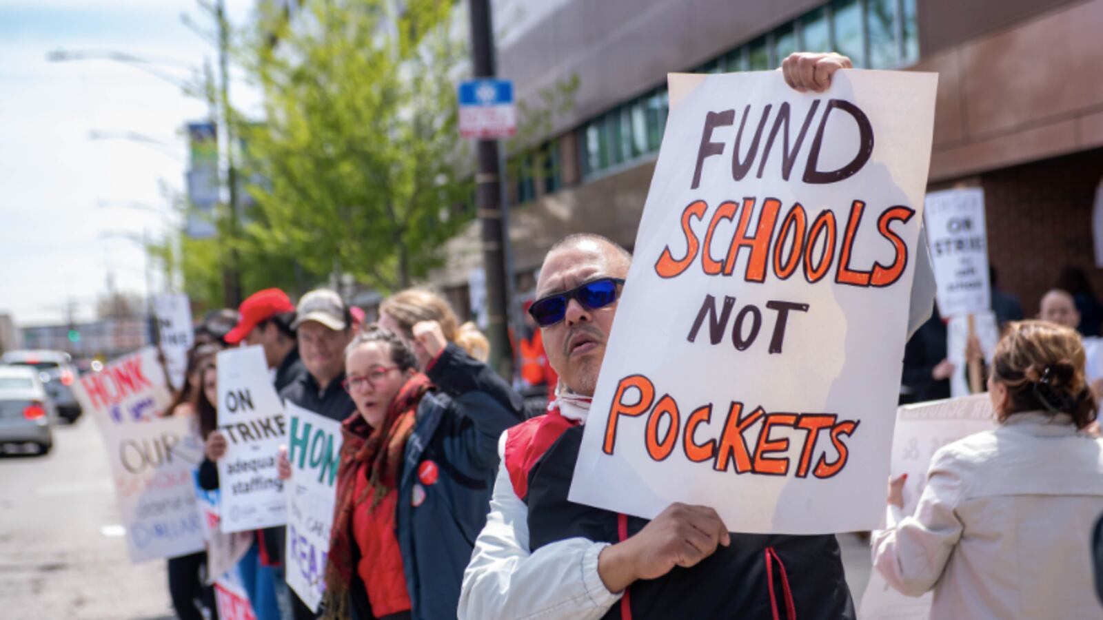 Teachers and supporters rally during Chicago's third charter teacher strike this school year.