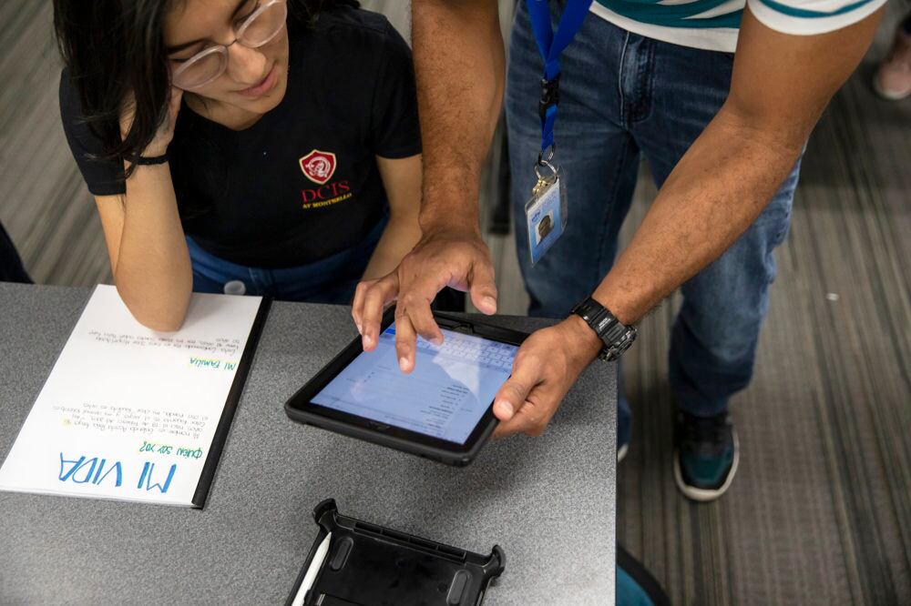 A student at Denver’s DCIS Montbello asks her teacher a question in May 2019.