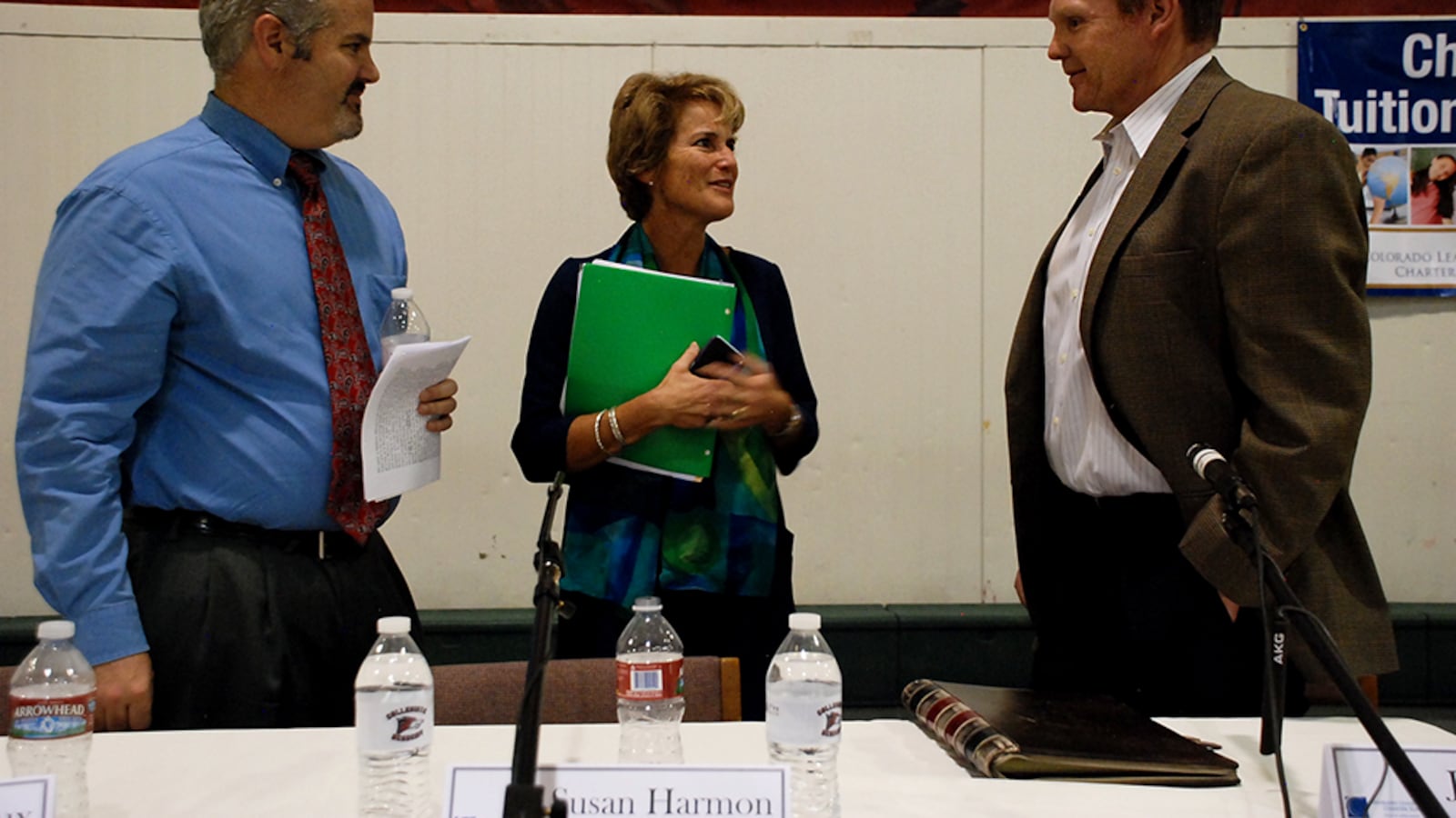 School board recall candidates Matthew Dhieux and Susan Harmon chat with incumbent John Newkirk after a candidate forum.