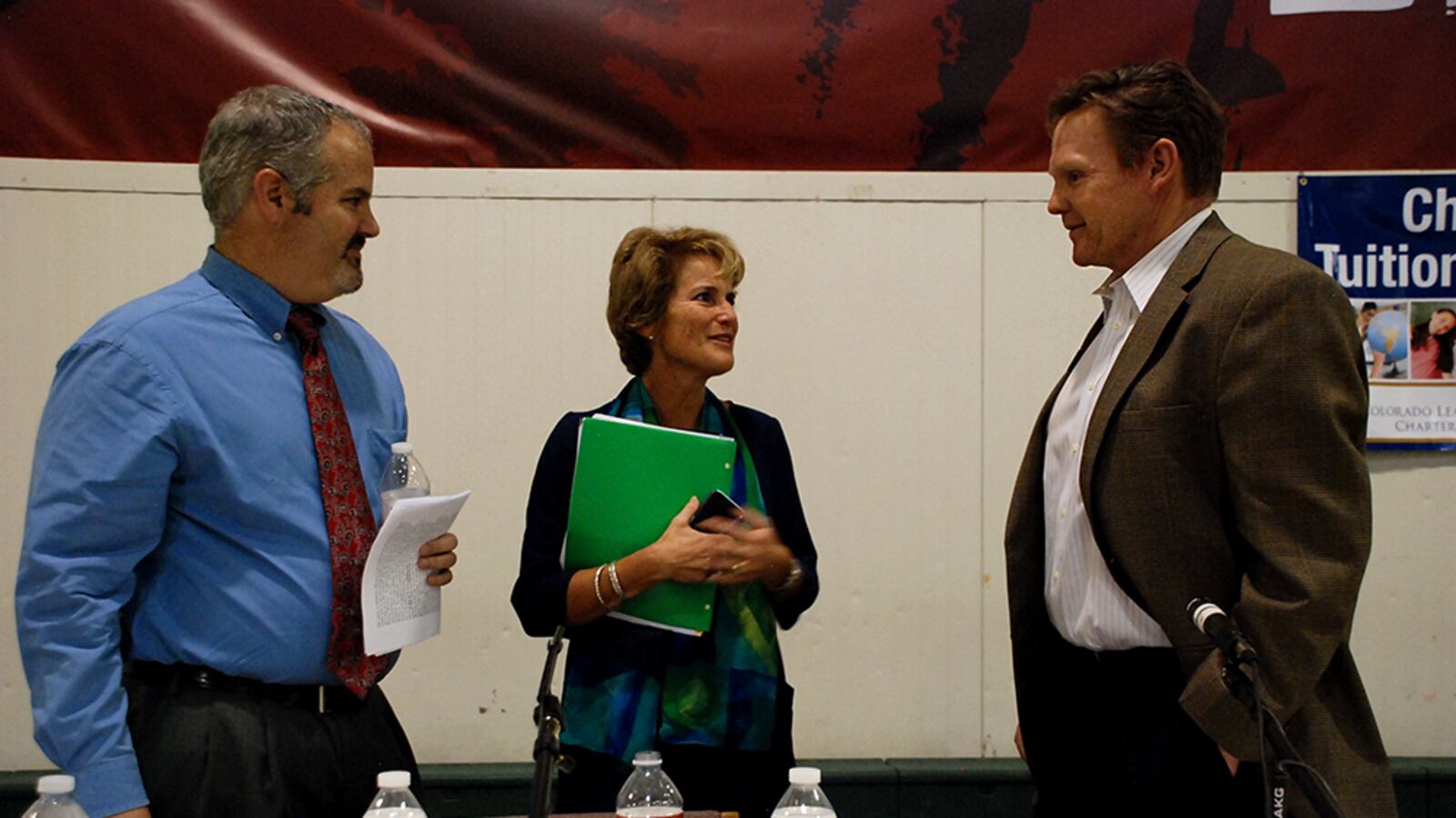 School board recall candidates Matthew Dhieux and Susan Harmon chat with incumbent John Newkirk after a candidate forum.