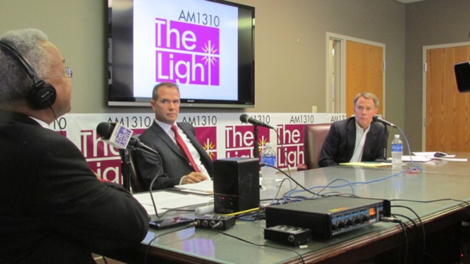 WTLC's Amos Brown (left) moderates a debate between Republican Chuck Brewer (center) and Democrat Joe Hogsett (right).