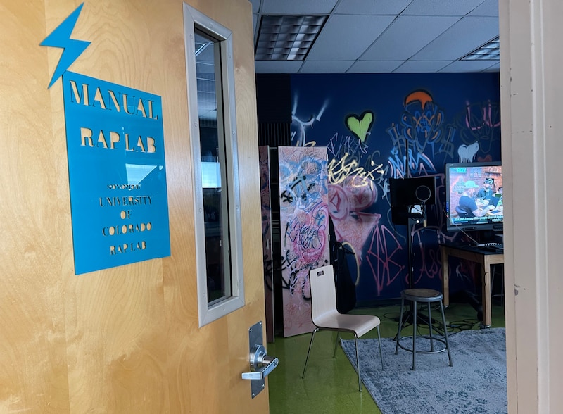 A door is open to the "Manual Rap Lab."