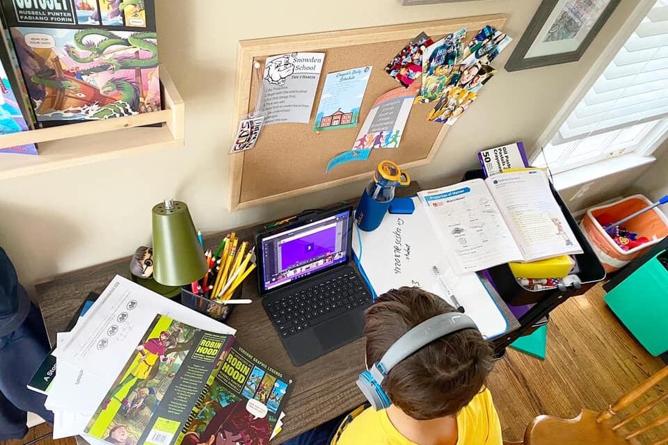 Aiden Tate completes schoolwork virtually last spring at his Memphis home.